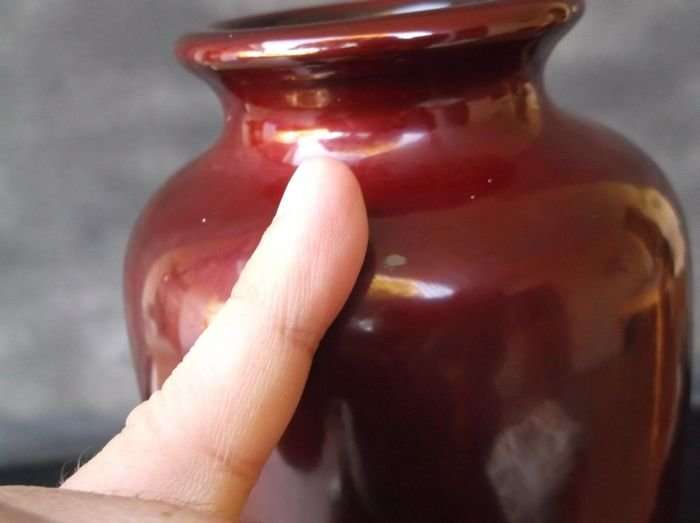 A VINTAGE JAPANESE VASE WITH ABALONE INLAY AND HAND PAINTED DETAIL OVER LACQUER / ENAMEL ?