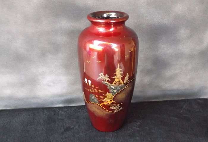 A VINTAGE JAPANESE VASE WITH ABALONE INLAY AND HAND PAINTED DETAIL OVER LACQUER / ENAMEL ?