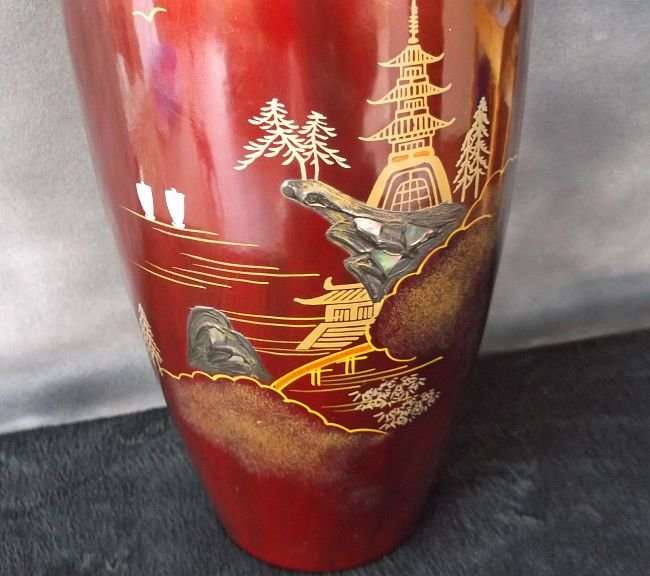 A VINTAGE JAPANESE VASE WITH ABALONE INLAY AND HAND PAINTED DETAIL OVER LACQUER / ENAMEL ?