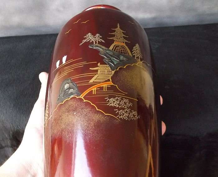 A VINTAGE JAPANESE VASE WITH ABALONE INLAY AND HAND PAINTED DETAIL OVER LACQUER / ENAMEL ?