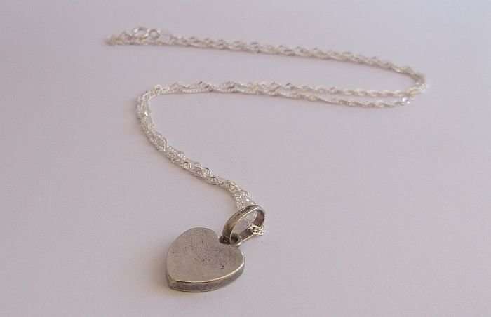 A STERLING SILVER NECKLACE PLUS A STERLING SILVER DESIGNER HEART PENDANT...ALESSI