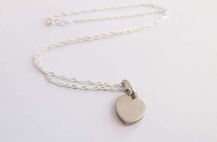 A STERLING SILVER NECKLACE PLUS A STERLING SILVER DESIGNER HEART PENDANT...ALESSI