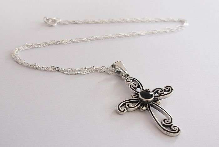 A STERLING SILVER NECKLACE PLUS A STERLING SILVER CROSS PENDANT...ONYX LOOK CENTER