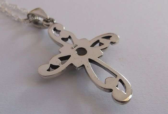 A STERLING SILVER NECKLACE PLUS A STERLING SILVER CROSS PENDANT...ONYX LOOK CENTER