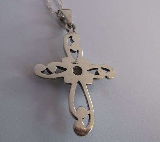 A STERLING SILVER NECKLACE PLUS A STERLING SILVER CROSS PENDANT...ONYX LOOK CENTER