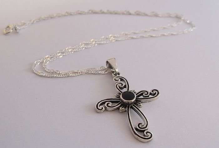 A STERLING SILVER NECKLACE PLUS A STERLING SILVER CROSS PENDANT...ONYX LOOK CENTER
