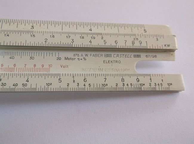 A COMPLICATED LOOKING VINTAGE A.W.FABER CASTELL SLIDE RULE IN LEATHER HOLDER ...COOL !!