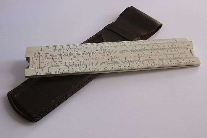 A COMPLICATED LOOKING VINTAGE A.W.FABER CASTELL SLIDE RULE IN LEATHER HOLDER ...COOL !!