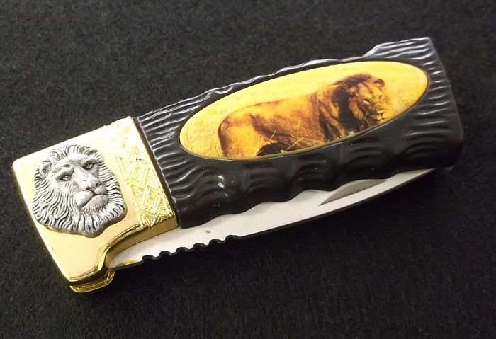 BIG 5 ...." LION " ....COLLECTORS KNIFE....GREAT BLADE....GOOD WEIGHT....AWESOME GIFT...WOW