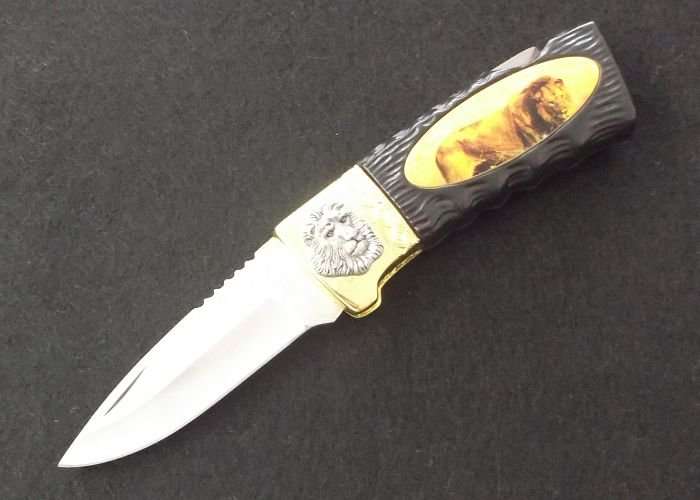 BIG 5 ...." LION " ....COLLECTORS KNIFE....GREAT BLADE....GOOD WEIGHT....AWESOME GIFT...WOW