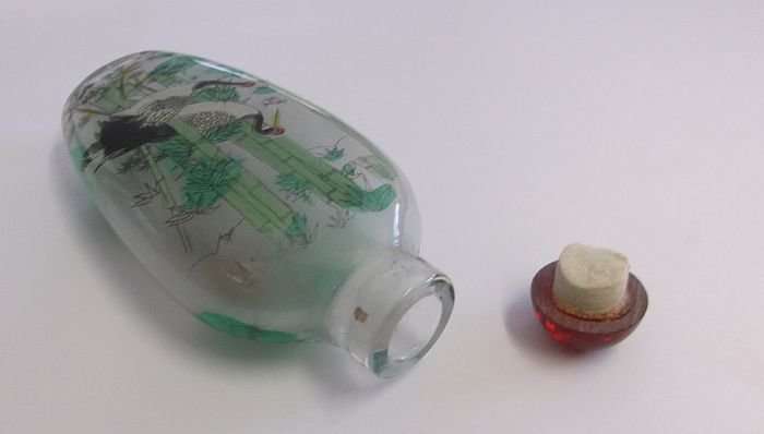 A FANTASTIC ORIENTAL GLASS SNUFF BOTTLE WITH WILD BIRD , BAMBOO AND FORREST DECORATION ...SWEET !!