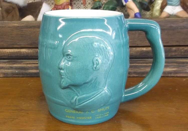 WOW !!! AFRICANA AT ITS BEST ...A VINTAGE ADVERTISING MUG DEPICTING GENERAL J.C SMUTS PRIME MINISTER