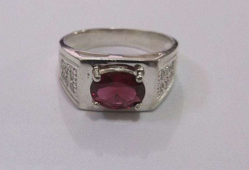 Brilliant Quality solid Sterling Silver ring with 12 clear faceted stones and one red faceted stone