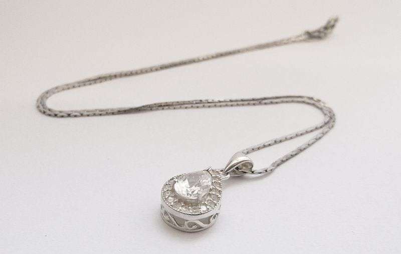 A vintage German silver necklace and a Sterling Silver pendant with a Fancy faceted Pear shape stone