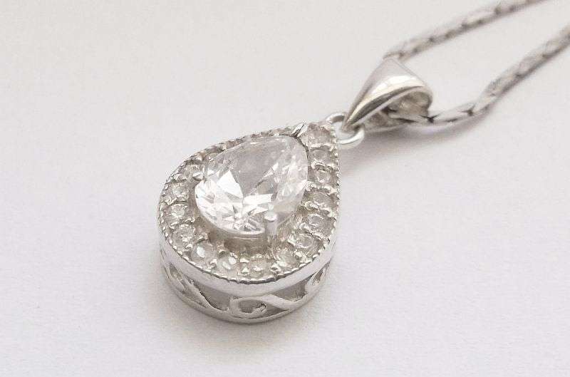 A vintage German silver necklace and a Sterling Silver pendant with a Fancy faceted Pear shape stone