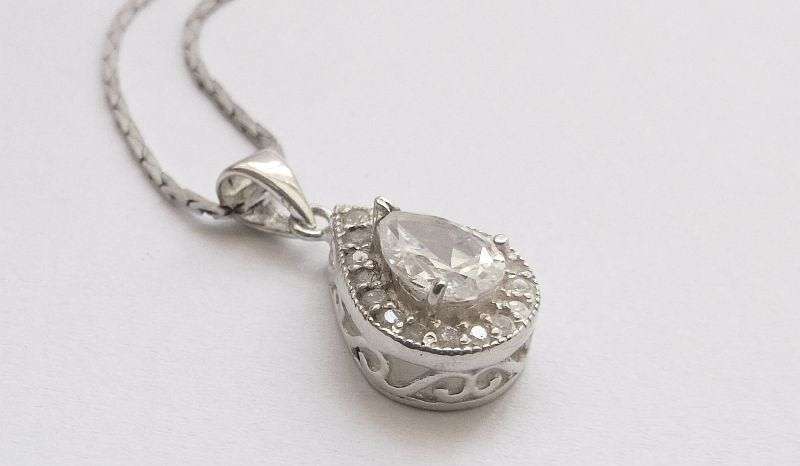 A vintage German silver necklace and a Sterling Silver pendant with a Fancy faceted Pear shape stone