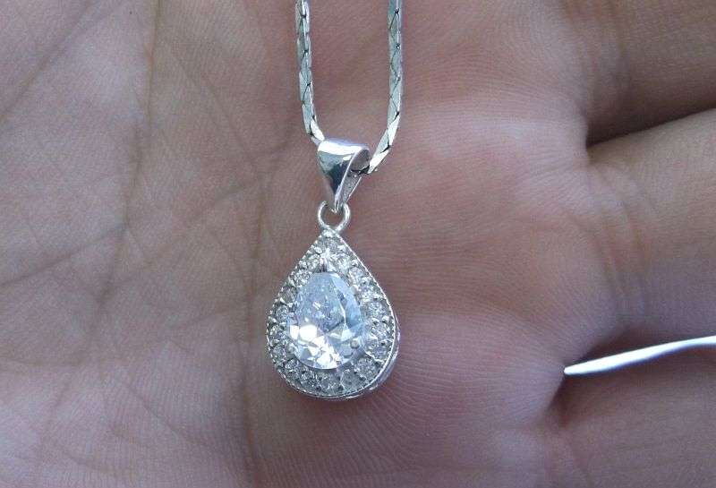 A vintage German silver necklace and a Sterling Silver pendant with a Fancy faceted Pear shape stone