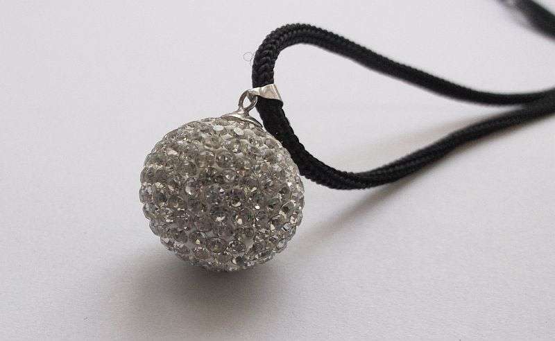 An extraordinary Disco ball style sterling silver pendant set with multiple faceted clear stones
