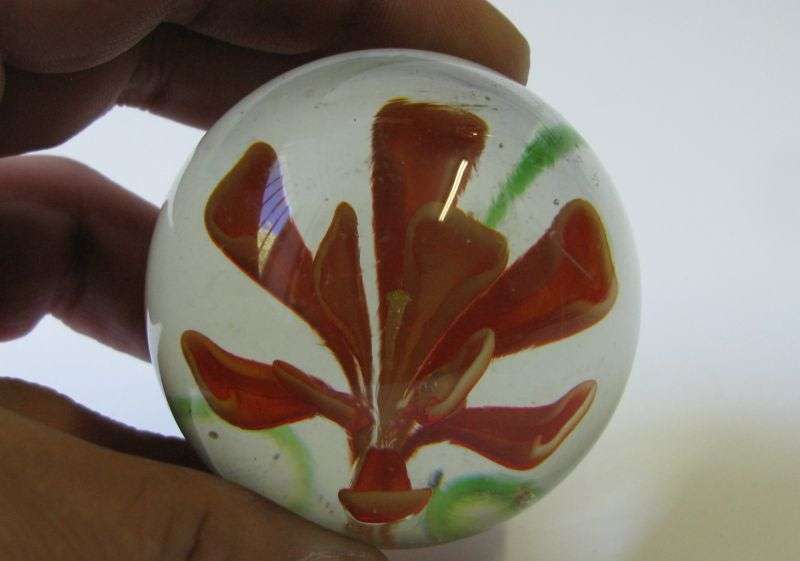 STUNNING !! A VINTAGE SOLID GLASS PAPERWEIGHT WITH ORANGE FLORAL DETAIL ...WOW !!