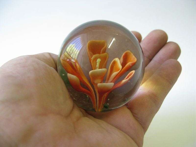 STUNNING !! A VINTAGE SOLID GLASS PAPERWEIGHT WITH ORANGE FLORAL DETAIL ...WOW !!