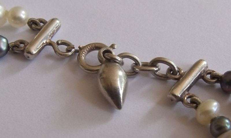 WOW !! AN ELEGANT DOUBLE STRAND GENUINE PEARL BRACELET WITH SOLID STERLING SILVER DESIGNER CLASP !!