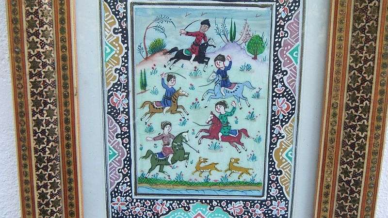 AN EYE CATCHING VINTAGE INLAID FRAME WITH GENUINE PAINTING OF EASTERN STYLE HORSEMEN !! WOW !!