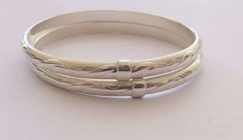 A GORGEOUS PAIR OF ITALIAN STERLING SILVER BANGLES WITH EYE CATCHING DETAIL !! BID FOR BOTH !!
