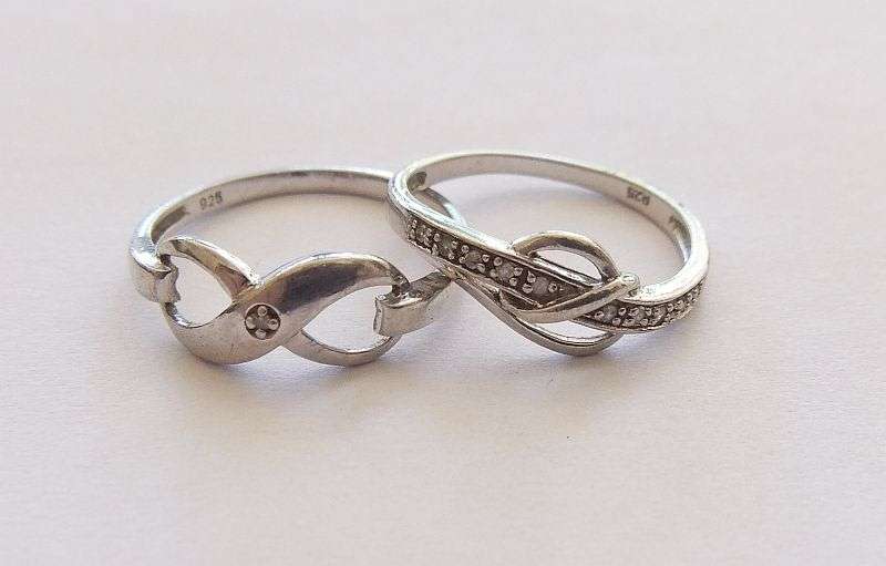 TWO STERLING SILVER RINGS - ETERNITY & FACETED STONES - BID FOR BOTH