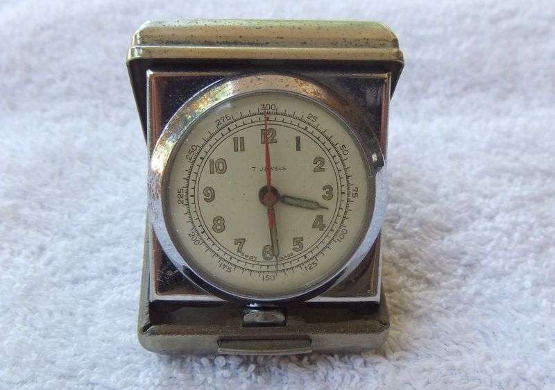 AN ART DECO STYLE / PERIOD SWISS FOLD UP TRAVELLING CLOCK - TICKS