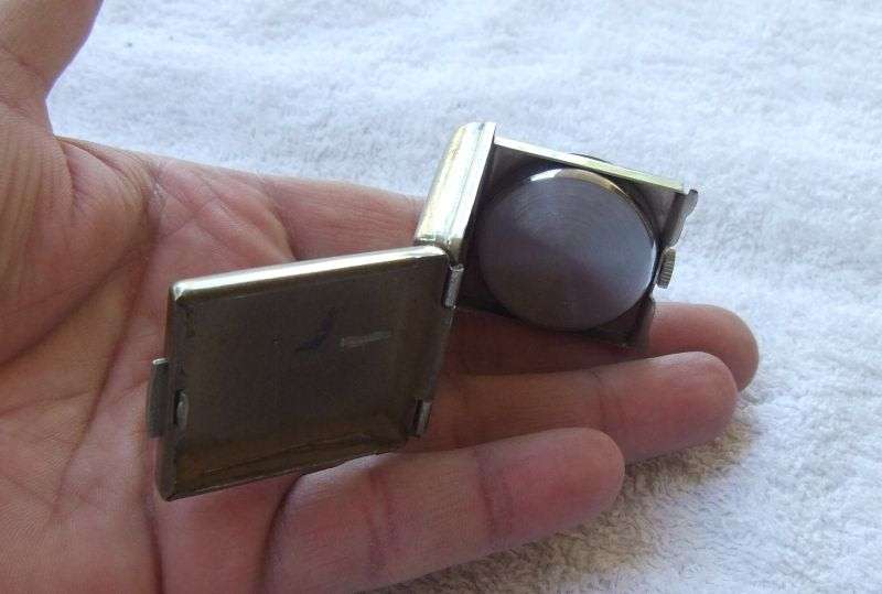 AN ART DECO STYLE / PERIOD SWISS FOLD UP TRAVELLING CLOCK - TICKS