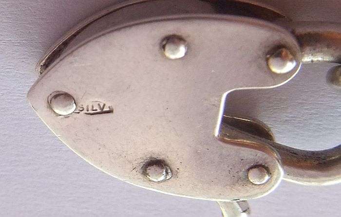 A STUNNING AND STRONG QUALITY VINTAGE SOLID STERLING SILVER CHARM STARTER BRACELET WITH HEART CLASP