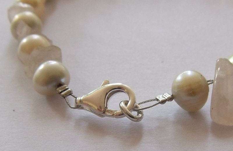 A GENUINE AKOYA PEARL , ROSE QUARTZ AND OTHER FRESHWATER PEARL BRACELET WITH STERLING SILVER CLASP