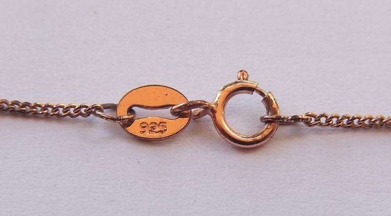 AN ANTIQUE 9CT ROSE GOLD PENDANT WITH FREE ROSE GOLD PLATED STERLING SILVER NECKLACE