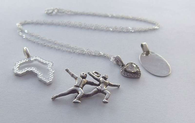 A LOVELY STERLING SILVER NECKLACE PLUS FOUR STERLING SILVER PENDANTS !! BID FOR THE LOT !! GOOD DEAL