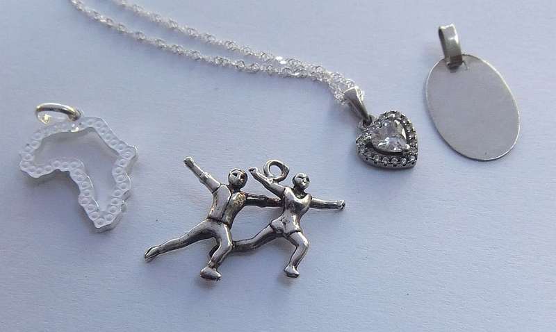 A LOVELY STERLING SILVER NECKLACE PLUS FOUR STERLING SILVER PENDANTS !! BID FOR THE LOT !! GOOD DEAL