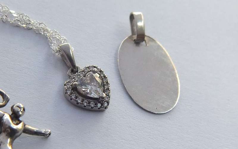 A LOVELY STERLING SILVER NECKLACE PLUS FOUR STERLING SILVER PENDANTS !! BID FOR THE LOT !! GOOD DEAL