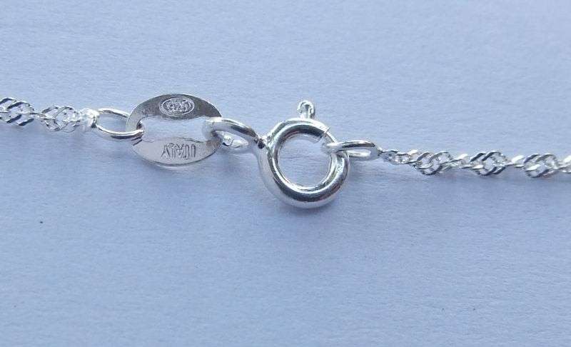 A LOVELY STERLING SILVER NECKLACE PLUS FOUR STERLING SILVER PENDANTS !! BID FOR THE LOT !! GOOD DEAL