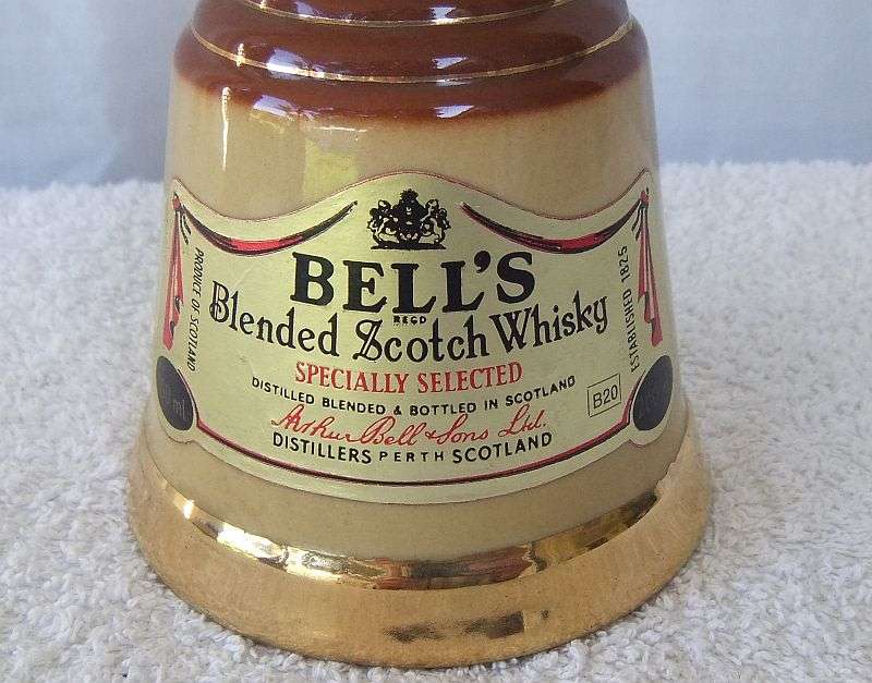 200 ML OF THE BEST !! A VINTAGE ""BELLS WHISKY"" IN A WADE PORCELAIN "BELL" SHAPED DECANTER - SEALED