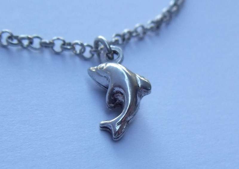 A FABULOUS ROUND LINK STERLING SILVER BRACELET WITH FOUR HOLLOW STARTER CHARMS , QUALITY CLASP !!