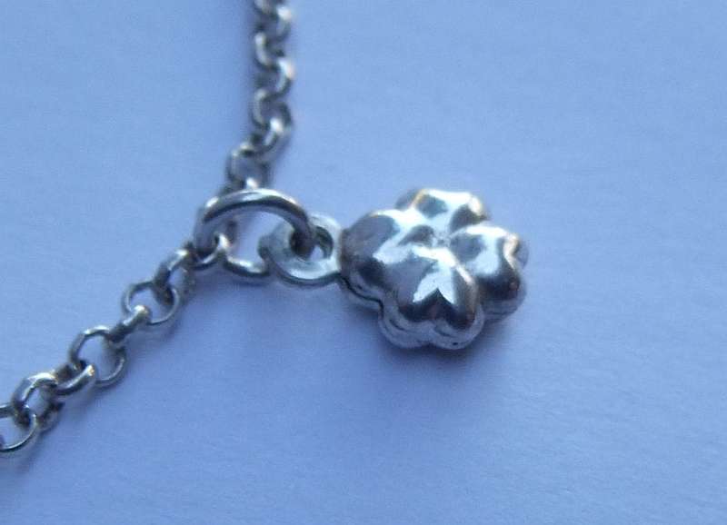 A FABULOUS ROUND LINK STERLING SILVER BRACELET WITH FOUR HOLLOW STARTER CHARMS , QUALITY CLASP !!