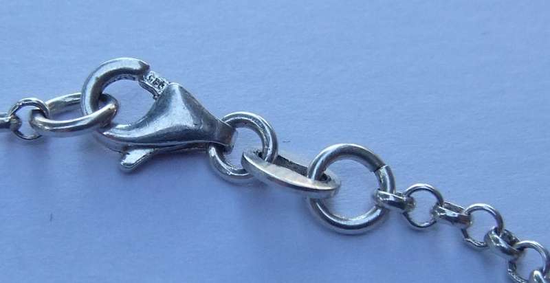 A FABULOUS ROUND LINK STERLING SILVER BRACELET WITH FOUR HOLLOW STARTER CHARMS , QUALITY CLASP !!
