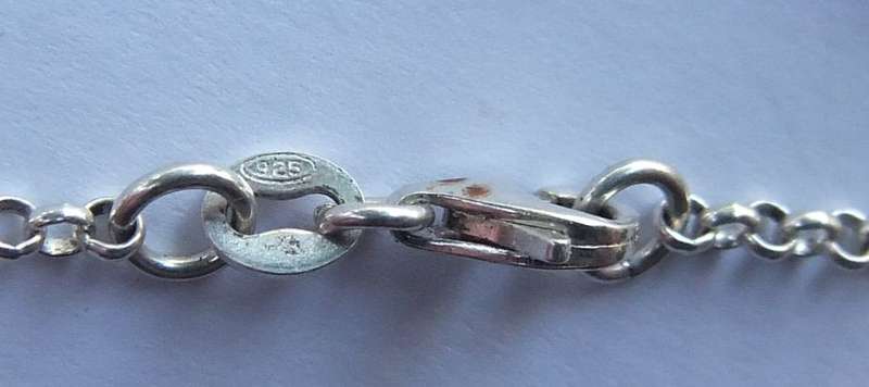 A FABULOUS ROUND LINK STERLING SILVER BRACELET WITH FOUR HOLLOW STARTER CHARMS , QUALITY CLASP !!