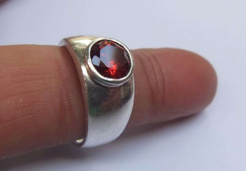 WOW !! A SUPERB QUALITY SOLID STERLING SILVER RING SET WITH AN AMAZING FACETED RED STONE !!