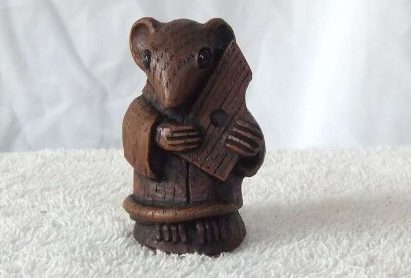 AN ADORABLE VINTAGE MOUSE WITH HARP ORNAMENT ..LOOKS LIKE CARVED WOOD BUT HEAVY LIKE RESIN ...NICE