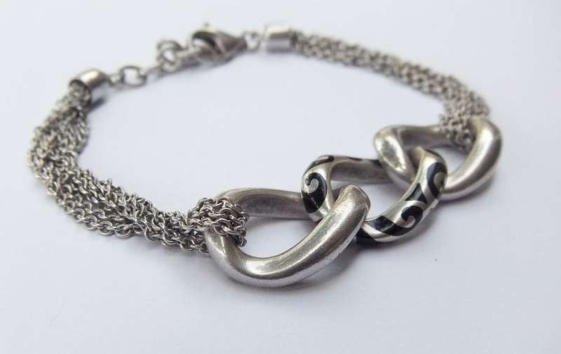 A SUPERIOR QUALITY DESIGNER MULTI STRAND BRACELET BY ESPRIT - STAMPED AND TESTED - HIGH VALUE