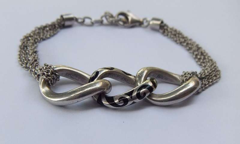 A SUPERIOR QUALITY DESIGNER MULTI STRAND BRACELET BY ESPRIT - STAMPED AND TESTED - HIGH VALUE