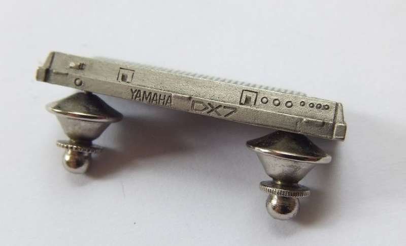 A VINTAGE PEWTER METAL YAMAHA DX7 KEYBOARD PIN