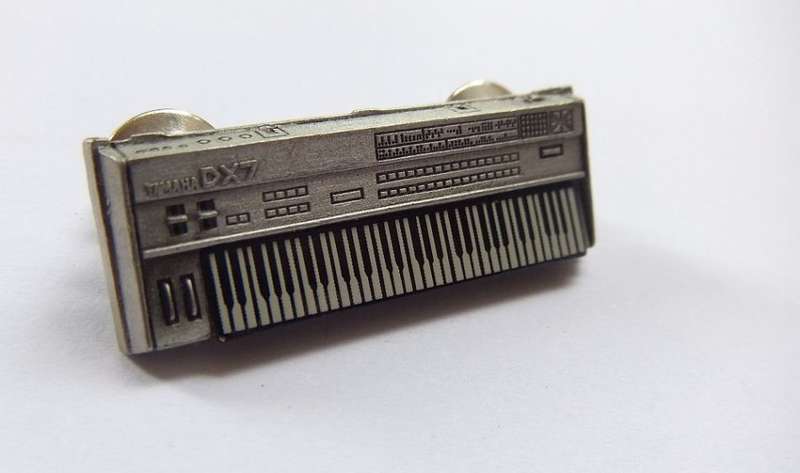 A VINTAGE PEWTER METAL YAMAHA DX7 KEYBOARD PIN