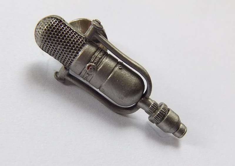 A VINTAGE PEWTER METAL STUDIO MIC LAPEL PIN MADE IN THE USA