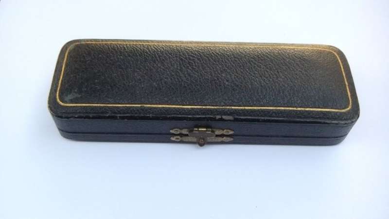 AN ANTIQUE BOX FOR A SILVER SPOON